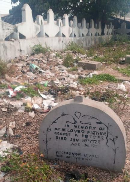 Defaced epitaph in the colonial cemetery