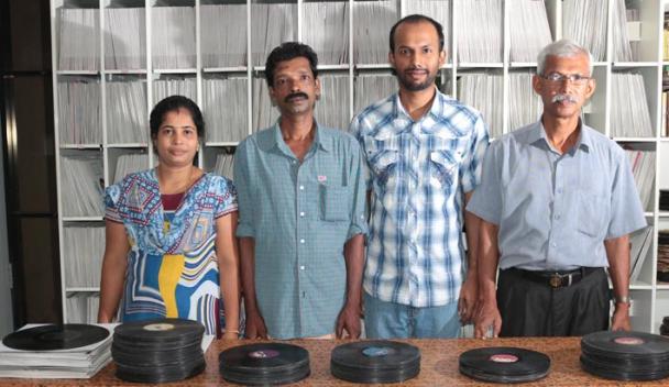 	 EAP796	EAP796_Pub001	Project team: (L-R) Ms Manju, Mr Shibu, Mr Mathews and Mr Kunnelpurayidom, with shellac records stored in the archive